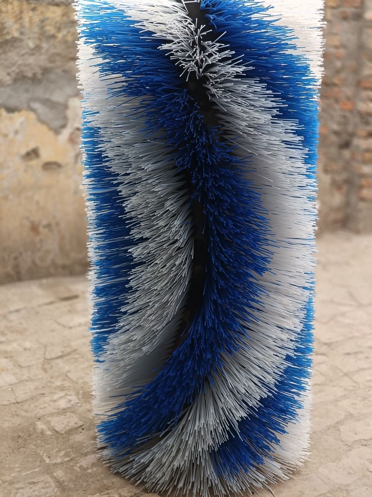 Spiral tufted nylon roller brush in blue and white filament