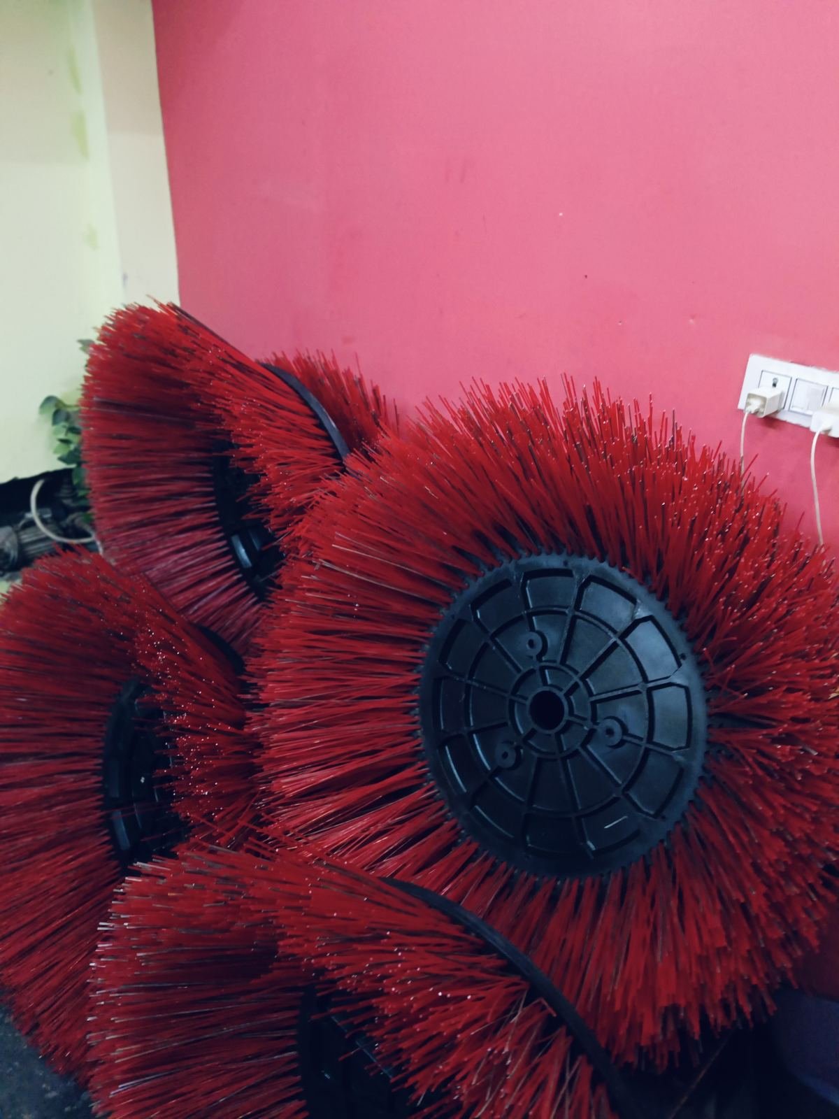 Red polypropylene road sweeper side brush on a moulded hub