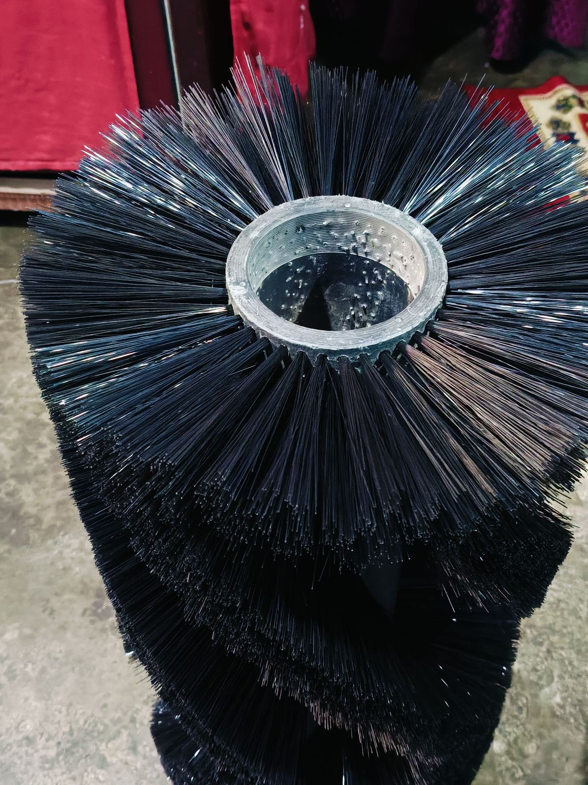Wafer ring broomer segments in nylon and wire mix stacked on a sweeper core